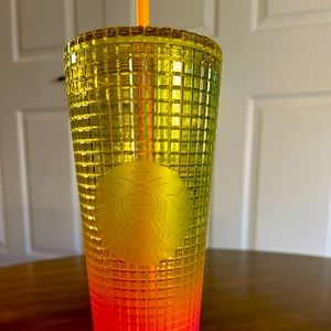 New Starbucks Tumbler made of Plastic with a pretty bright orange into yellow